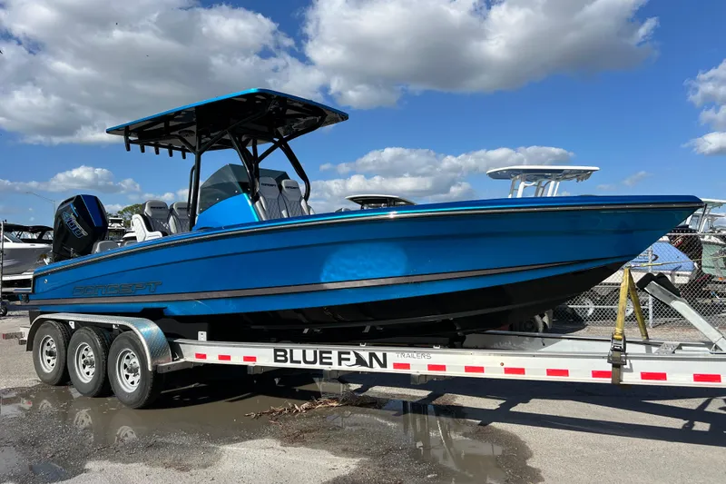 Slide: The Image of 2025 Concept 27' Open Deck boat on trailer under blue sky. - 15