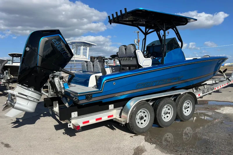 Slide: The Image of 2025 Concept 27' Open Deck boat on trailer, featuring powerful outboard motor. - 17