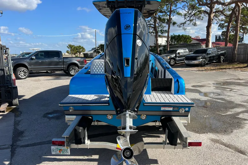 Slide: The Image of 2025 Concept 27' Open Deck boat with powerful outboard motor, parked on a trailer. - 18