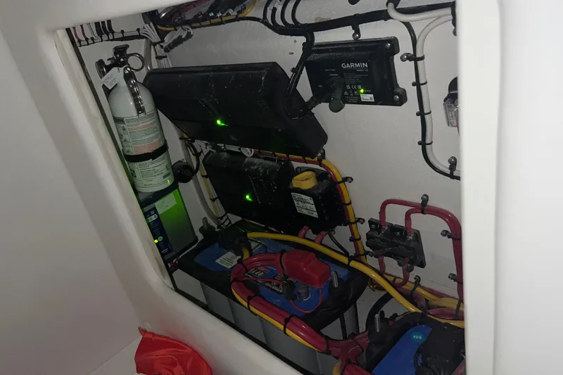 Slide: The Image of Electrical compartment of 2025 Concept 27' Open Deck boat with wiring and equipment. - 22