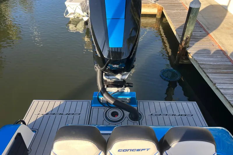 Slide: The Image of 2025 Concept 27' Open Deck boat at dock, featuring sleek design and powerful engine. - 24