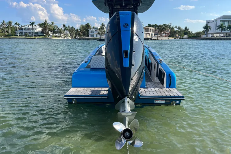 Slide: The Image of 2025 Concept 27' Open Deck boat on clear water, showcasing sleek design and powerful engine. - 3