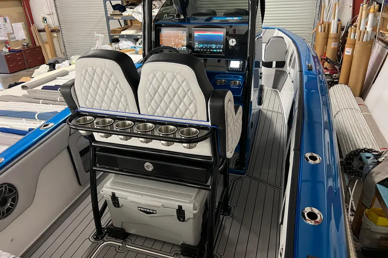 Slide: The Image of 2025 Concept 27' Open Deck boat interior with modern seating and navigation system. - 5