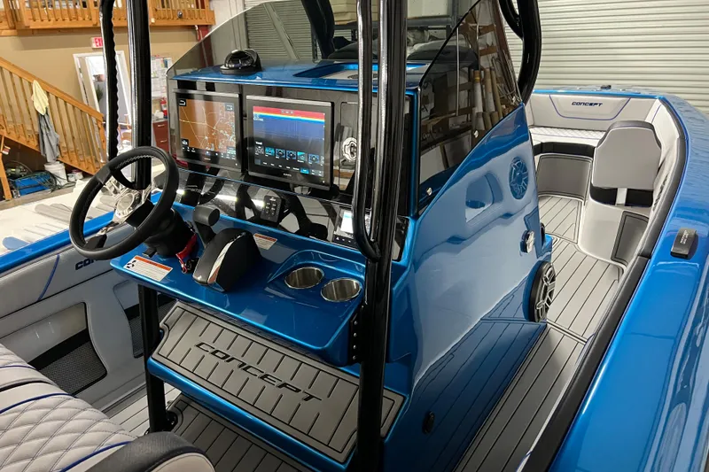 Slide: The Image of 2025 Concept 27' Open Deck boat interior with modern dashboard and sleek blue design. - 6