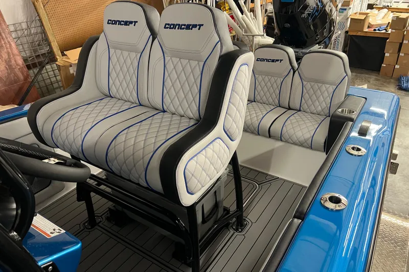 Slide: The Image of 2025 Concept 27' Open Deck boat dashboard with steering wheel and digital displays. - 8