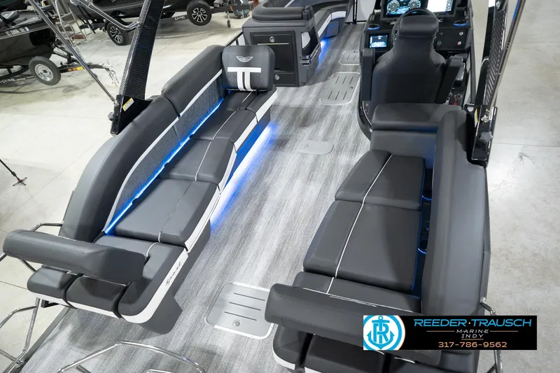 Slide: The Image of 2026 Bennington 24 MSL boat interior with sleek seating and modern dashboard. - 14