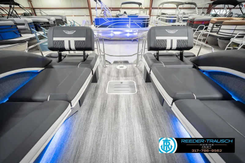 Slide: The Image of 2026 Bennington 24 MSL pontoon boat interior with sleek seating and ambient lighting. - 18