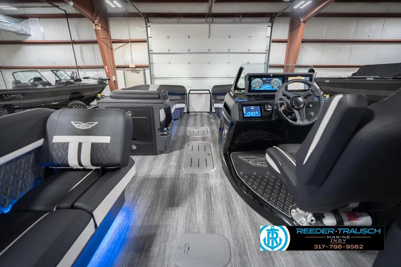 Slide: The Image of 2026 Bennington 24 MSL pontoon boat interior with modern dashboard and seating. - 20