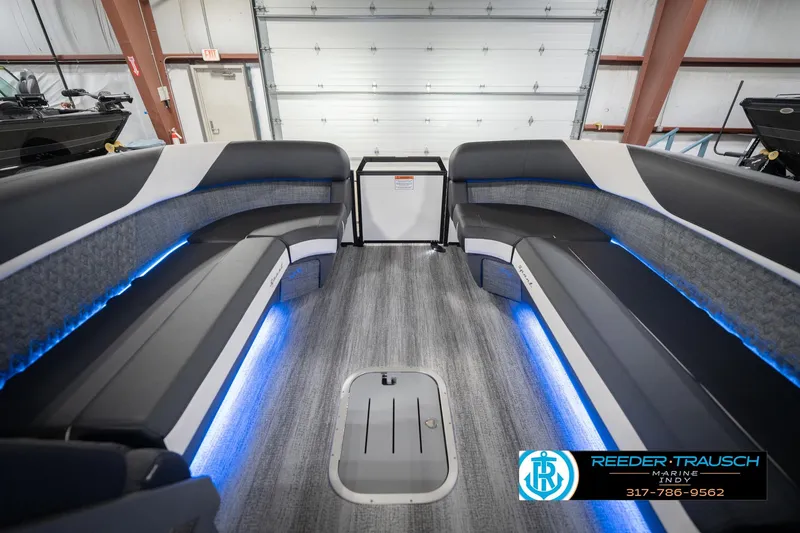 Slide: The Image of Interior of 2026 Bennington 24 MSL pontoon boat with blue LED lighting. - 21