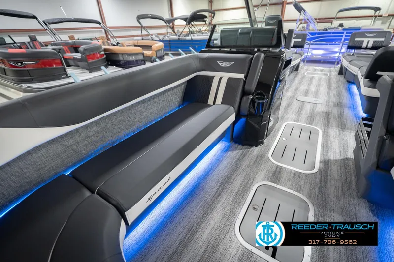 Slide: The Image of 2026 Bennington 24 MSL pontoon boat interior with blue LED lighting and modern seating. - 22