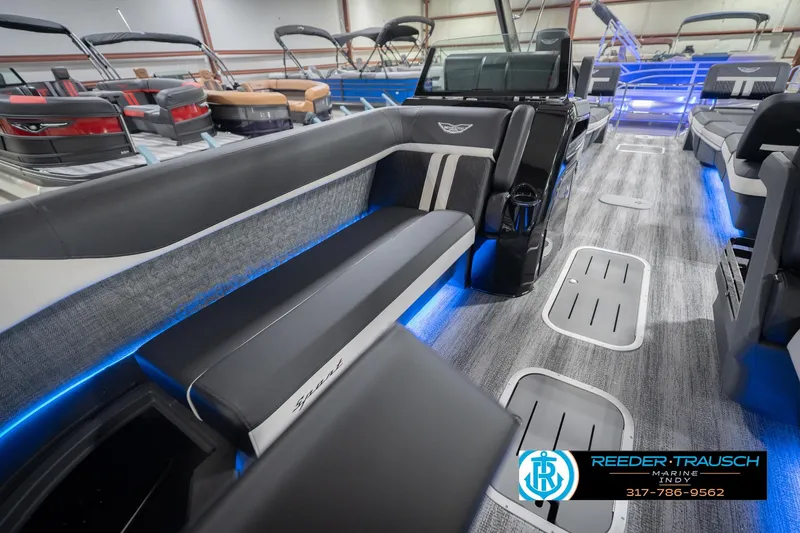 Slide: The Image of 2026 Bennington 24 MSL pontoon boat interior with modern seating and blue LED lighting. - 25