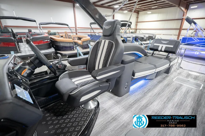 Slide: The Image of 2026 Bennington 24 MSL pontoon boat interior with luxury seating and modern dashboard. - 27