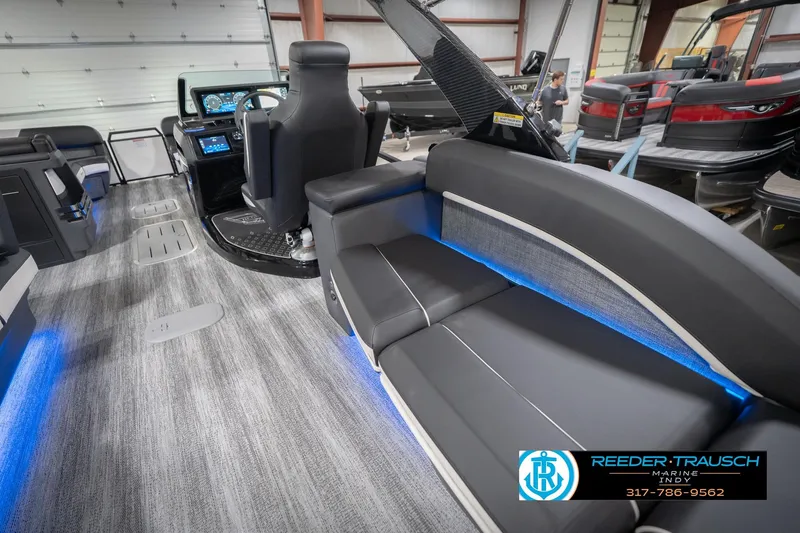 Slide: The Image of 2026 Bennington 24 MSL boat interior with modern seating and illuminated accents. - 30