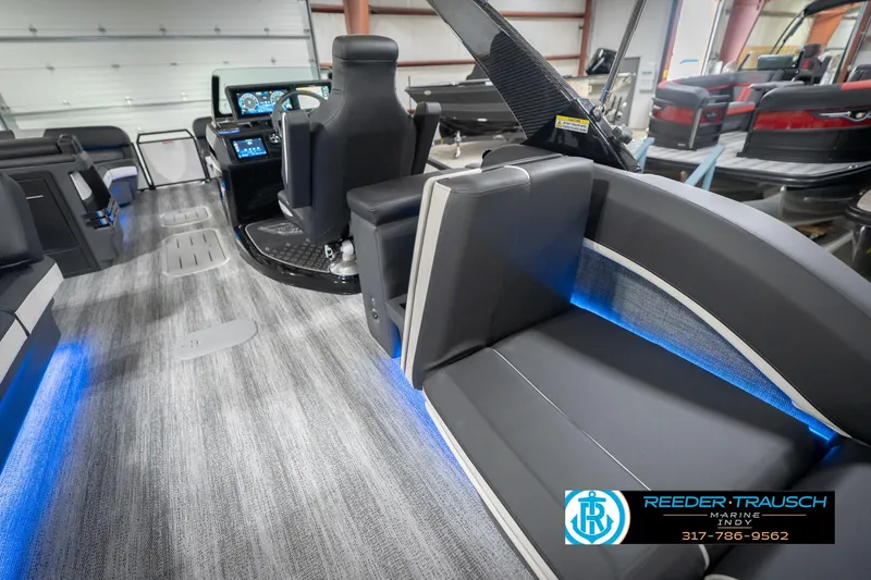 Slide: The Image of 2026 Bennington 24 MSL boat interior with modern seating and illuminated accents. - 32