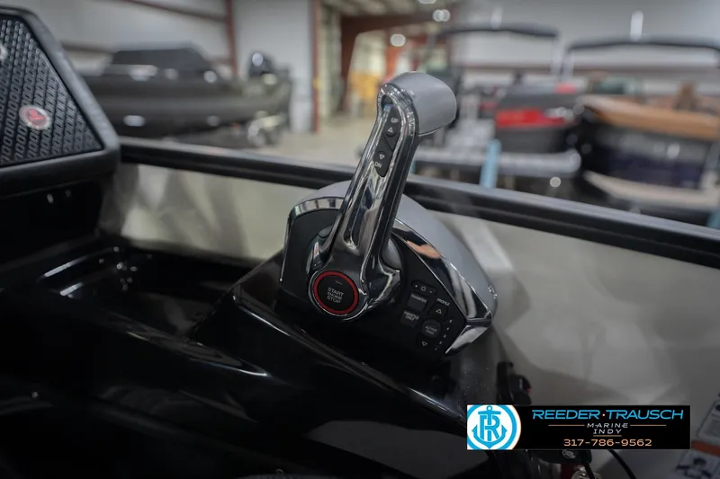 Slide: The Image of 2026 Bennington 24 MSL boat throttle control in showroom, featuring start/stop button. - 45