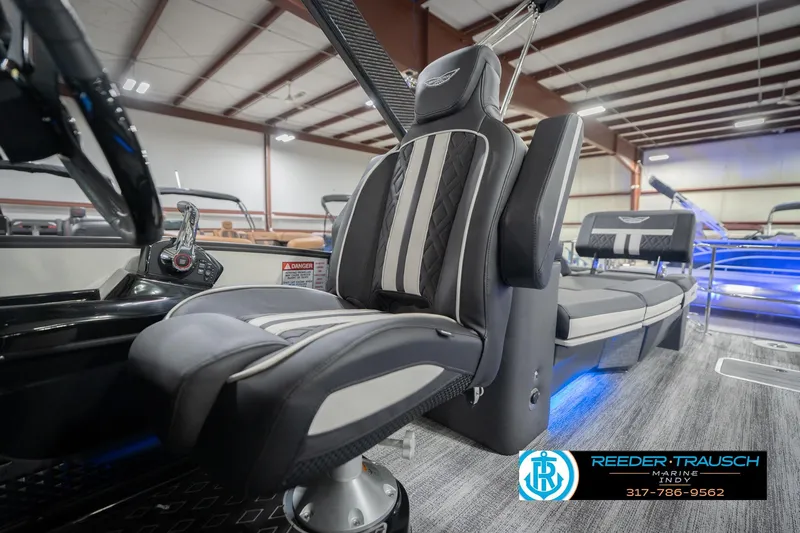 Slide: The Image of Luxurious interior of 2026 Bennington 24 MSL boat with premium seating and modern controls. - 46