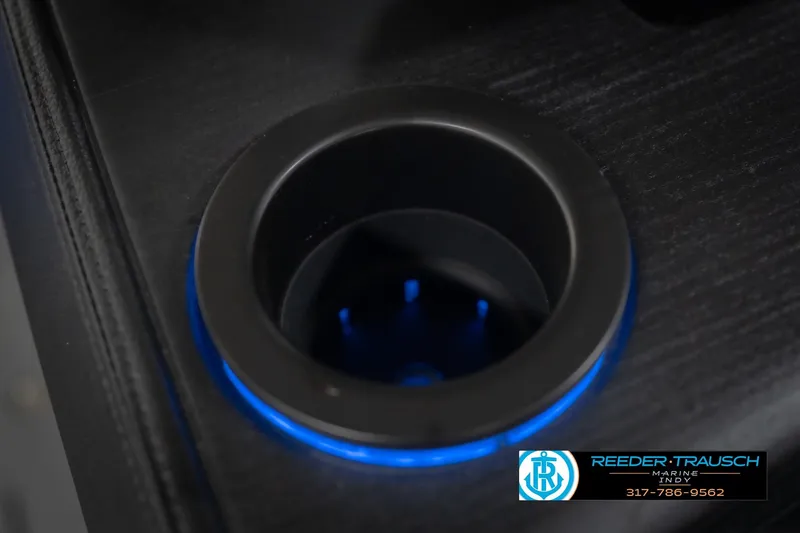 Slide: The Image of Illuminated cup holder on 2026 Bennington 24 MSL boat, featuring blue LED lighting. - 52