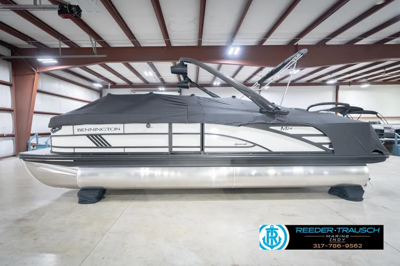 Slide: The Image of 2026 Bennington 24 MSL pontoon boat in indoor storage, covered and secured. - 58