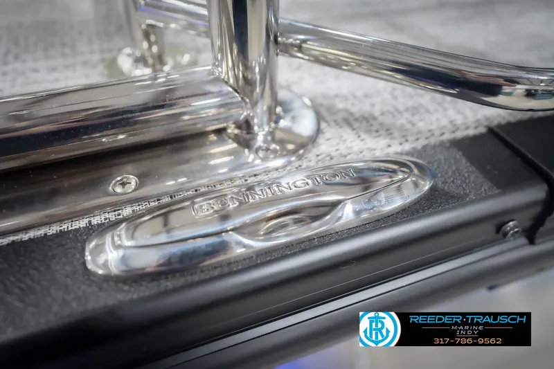 Slide: The Image of Close-up of 2026 Bennington 24 MSL boat detail with chrome finish and logo. - 59