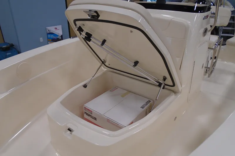 Slide: The Image of 2026 Scout 188 Sportfish boat storage compartment with Yamaha propeller box inside. - 11
