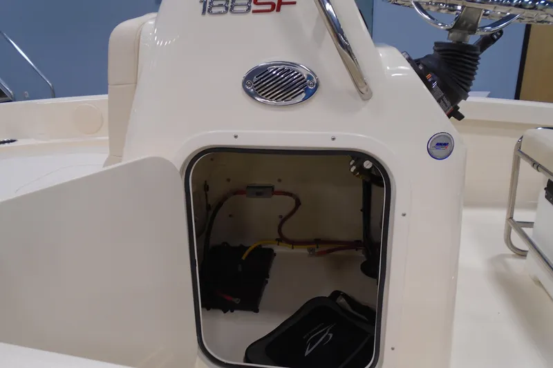 Slide: The Image of 2026 Scout 188 Sportfish boat console with open storage compartment. - 14
