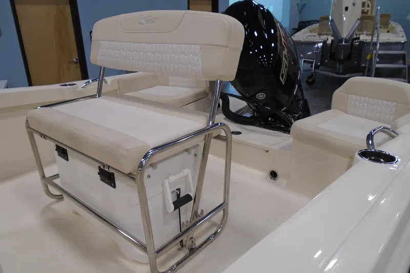 Slide: The Image of 2026 Scout 188 Sportfish boat interior with seating and outboard motor. - 15