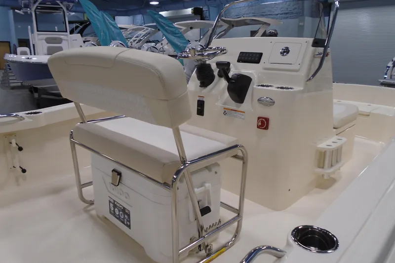 Slide: The Image of 2026 Scout 188 Sportfish boat interior with helm, seating, and storage features. - 5