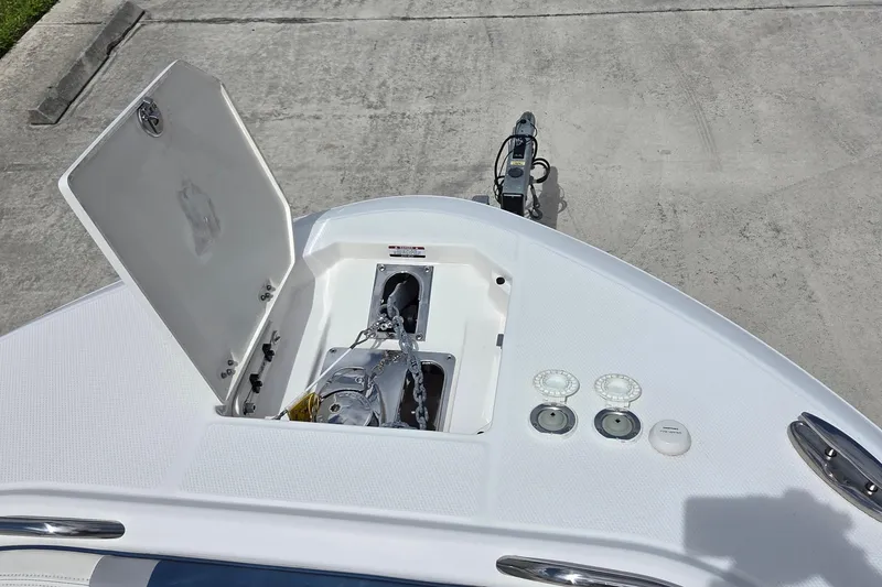 Slide: The Image of 2022 Robalo R272 Center Console boat anchor compartment and deck details. - 11