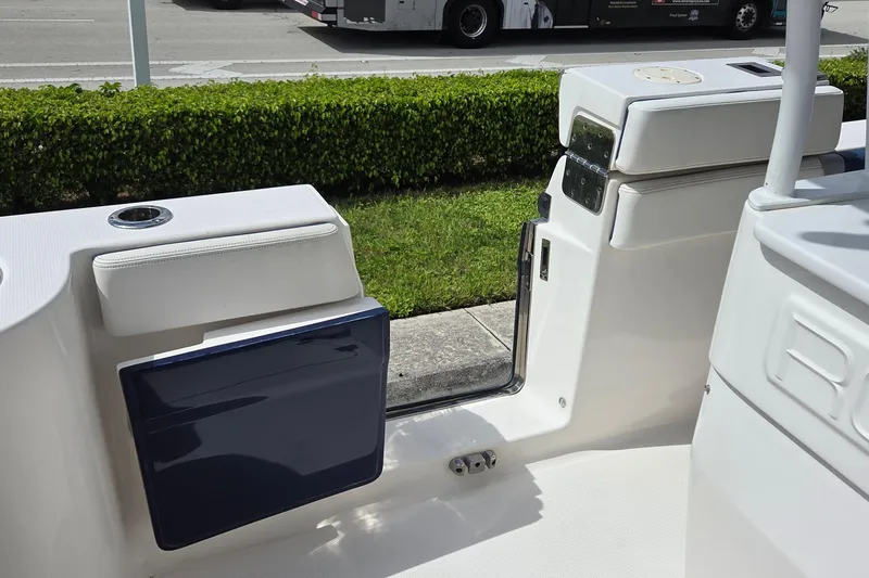 Slide: The Image of 2022 Robalo R272 Center Console boat interior with seating and storage compartments. - 15