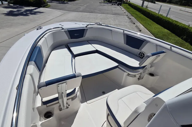 Slide: The Image of 2022 Robalo R272 Center Console boat with spacious seating and sleek design. - 6