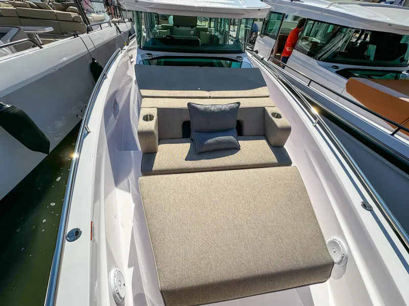 Slide: The Image of 2024 Axopar 37XC CROSS CABIN with spacious sunbed and modern design. - 17