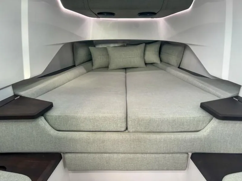 Slide: The Image of Luxurious cabin interior of 2024 Axopar 37XC CROSS CABIN with plush bedding. - 13
