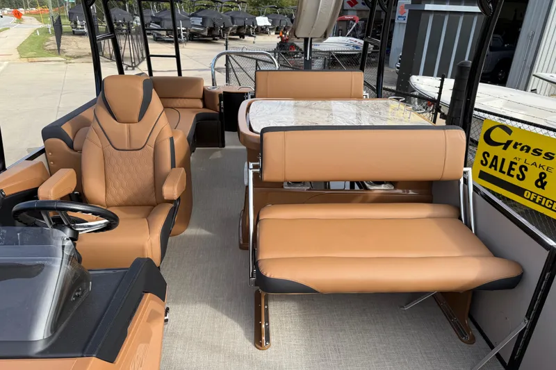 Slide: The Image of 2026 Avalon Catalina Entertainer Funship interior with tan seating and steering wheel. - 16