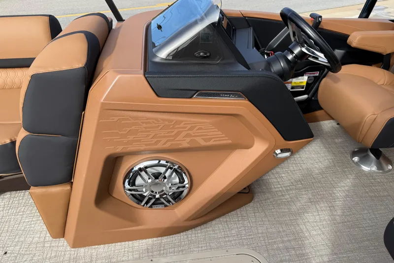 Slide: The Image of 2026 Avalon Catalina Entertainer Funship interior with tan and black seating, modern dashboard, and speaker. - 20