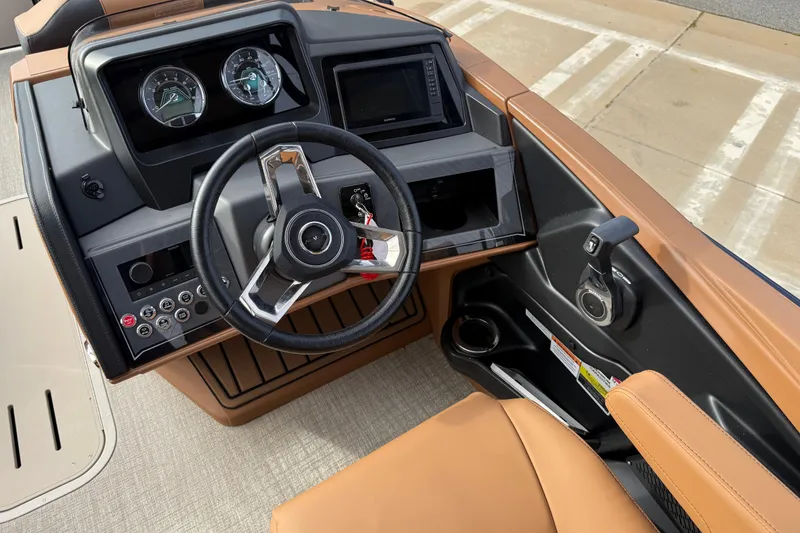 Slide: The Image of 2026 Avalon Catalina Entertainer Funship dashboard with steering wheel and control panel. - 21