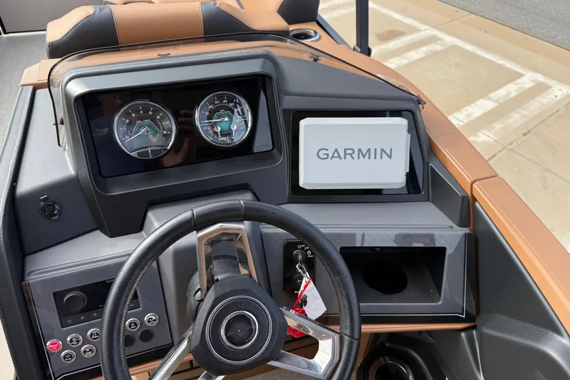 Slide: The Image of Steering console of 2026 Avalon Catalina Entertainer Funship with Garmin display and gauges. - 27