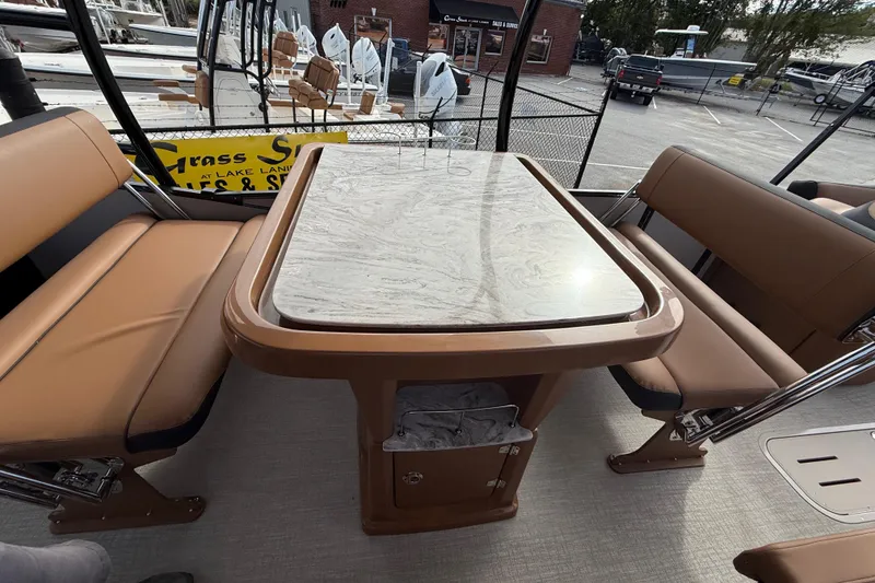 Slide: The Image of Luxurious seating area on 2026 Avalon Catalina Entertainer Funship with elegant table design. - 38