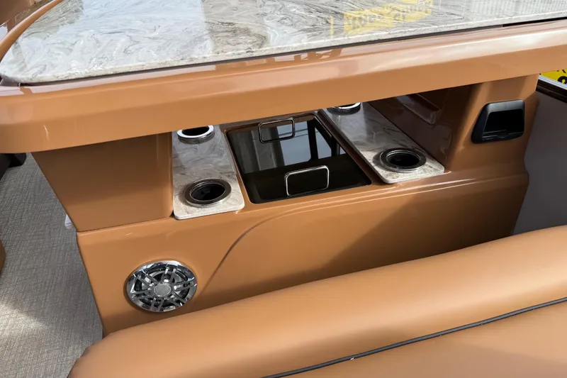 Slide: The Image of 2026 Avalon Catalina Entertainer Funship interior with cup holders and speaker. - 39