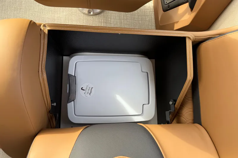 Slide: The Image of Storage compartment in Avalon Catalina Entertainer Funship 2026 with tan leather seating. - 43