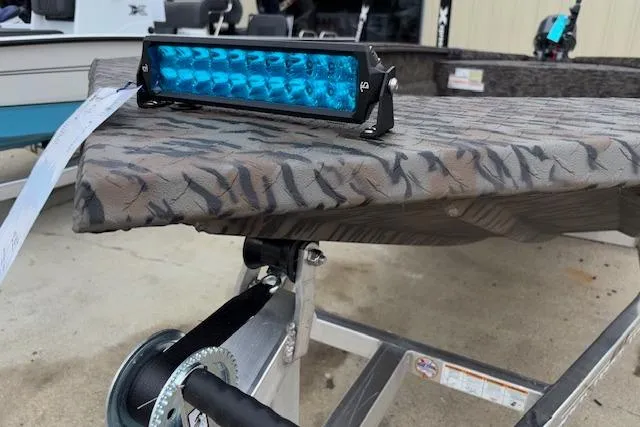 Slide: The Image of Blue LED light on camo-patterned Xpress XTS16 boat, 2026 model. - 13