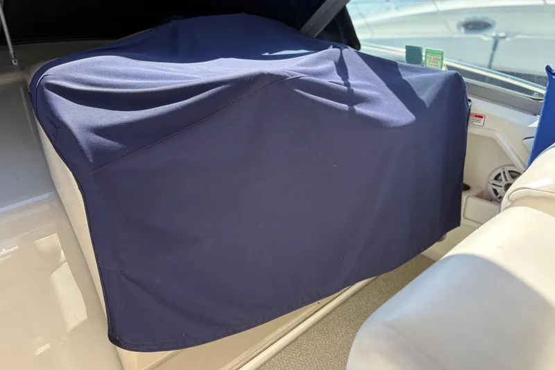Slide: The Image of Covered seating area on a 2006 Sea Ray 320 Sundancer boat. - 11
