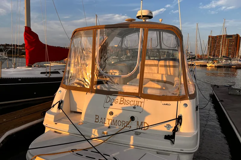 Slide: The Image of 2006 Sea Ray 320 Sundancer docked at marina, sunset lighting, Baltimore, MD. - 2