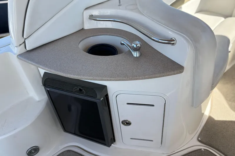 Slide: The Image of 2006 Sea Ray 320 Sundancer boat kitchenette with sink and mini fridge. - 9