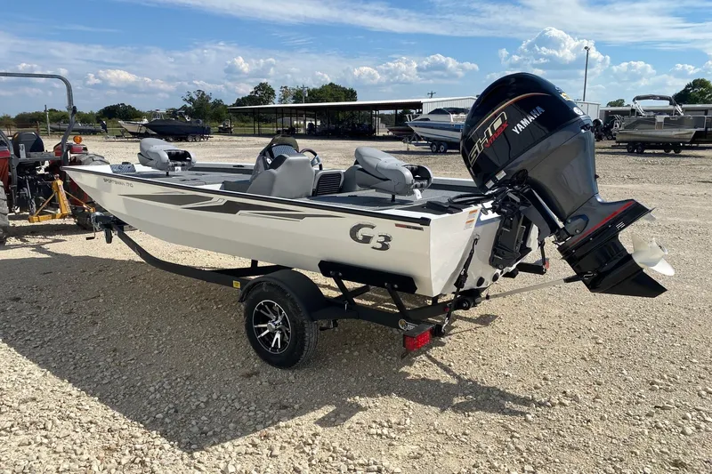 Slide: The Image of 2026 G3 Sportsman 1710PFX boat with Yamaha motor on a trailer, parked outdoors. - 3
