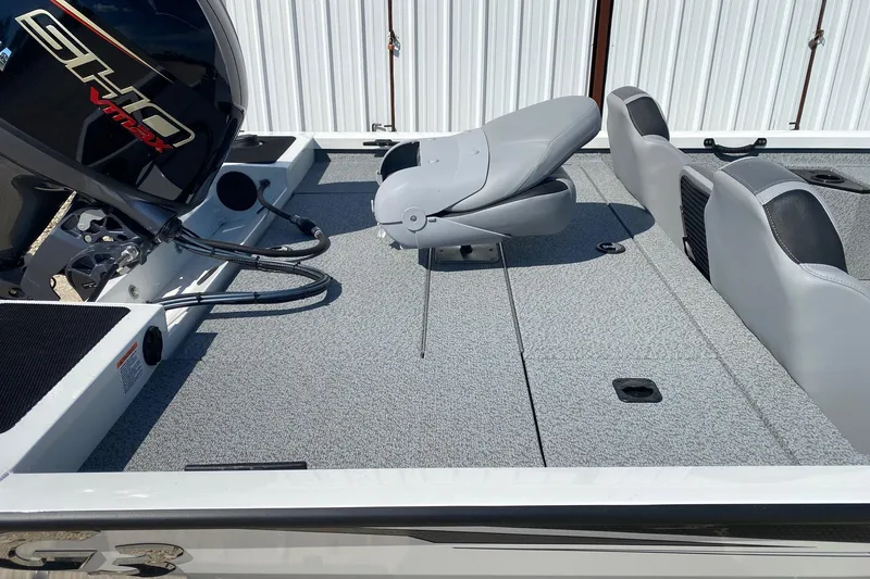 Slide: The Image of 2026 G3 Sportsman 1710PFX boat interior with seating and motor, showcasing modern design. - 9