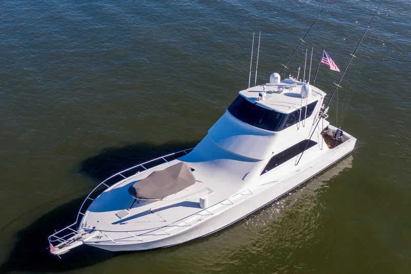 Slide: The Image of 2002 Viking 65 Enclosed Bridge yacht on calm water, aerial view. - 10