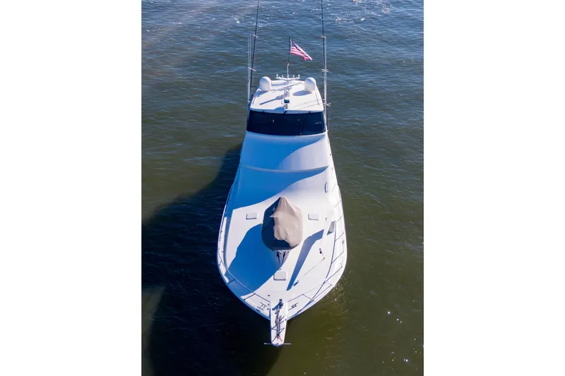 Slide: The Image of 2002 Viking 65 Enclosed Bridge yacht on open water, aerial view. - 11