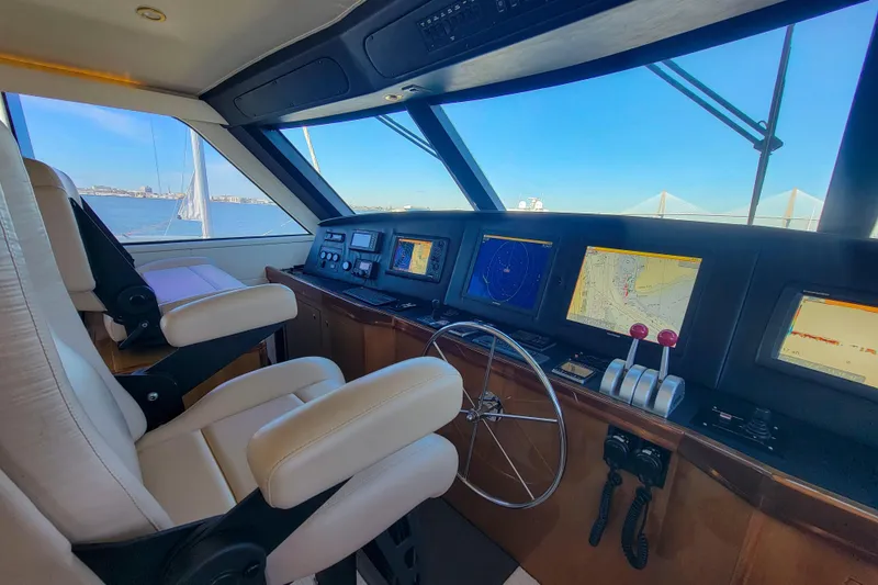 Slide: The Image of Luxurious 2002 Viking 65 Enclosed Bridge yacht cockpit with advanced navigation systems. - 37