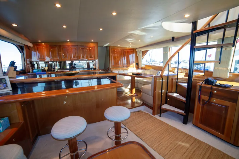 Slide: The Image of Luxurious interior of 2002 Viking 65 Enclosed Bridge yacht with elegant wood finishes. - 57