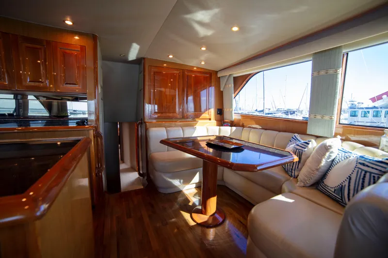 Slide: The Image of Luxurious interior of 2002 Viking 65 Enclosed Bridge yacht with elegant wood finishes. - 65